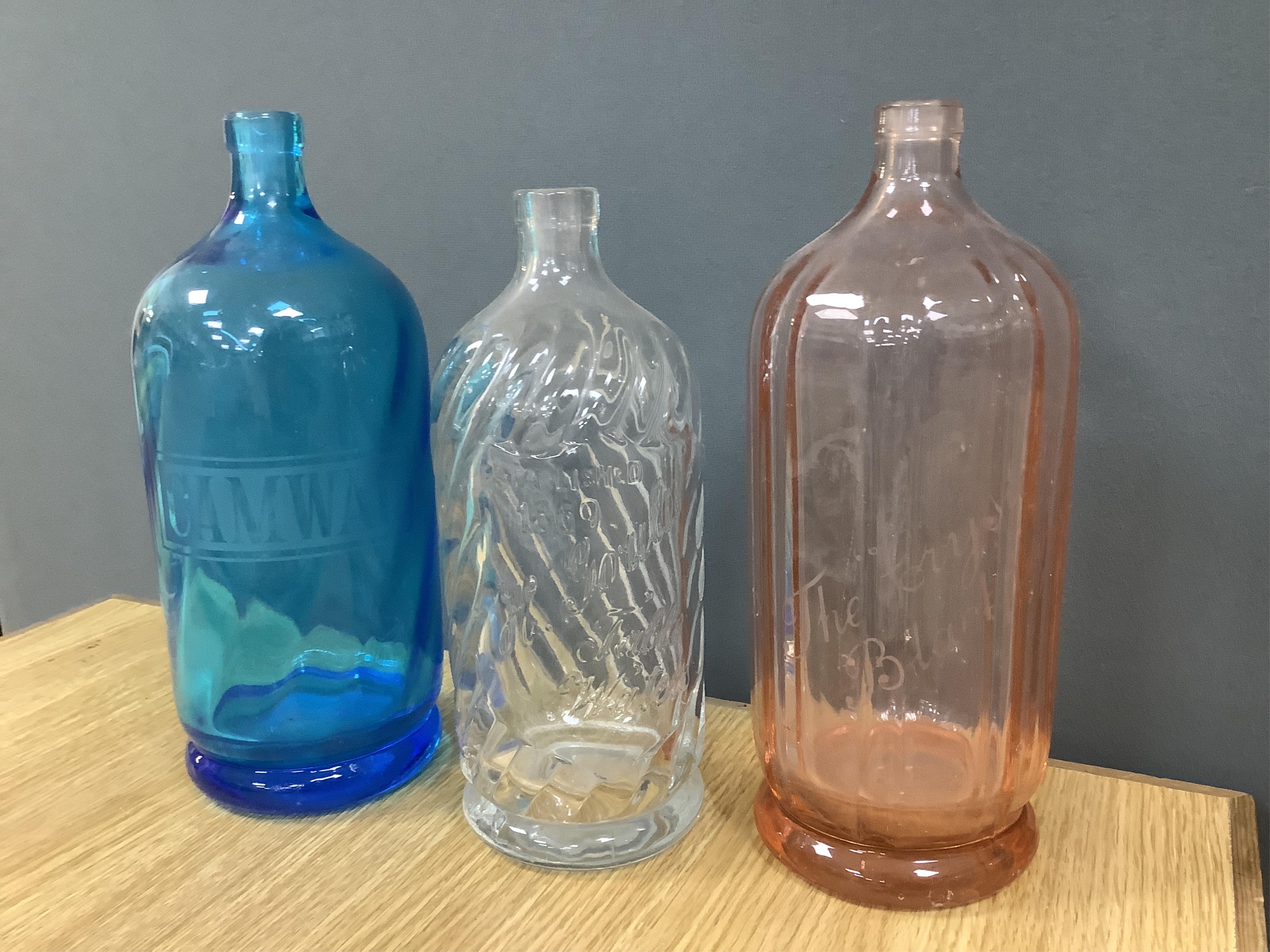 An Edwardian Standard English Seltzogenes double gourd Soda Syphon, one other and a collection of coloured glass bottles. Condition - varies